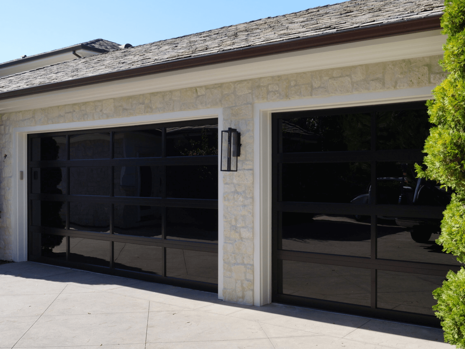 modernblackglassgaragedoorwithti 1